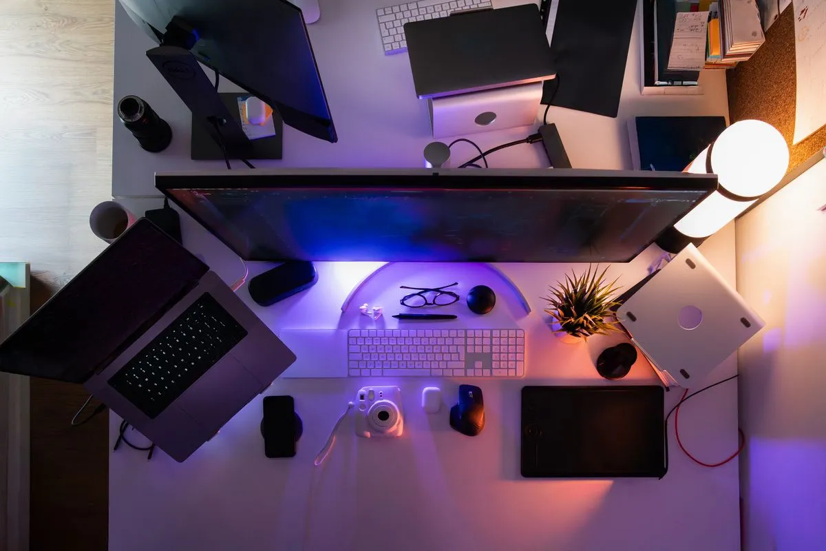 Modern productivity desk setup with wireless mouse charging hub and tablet stand